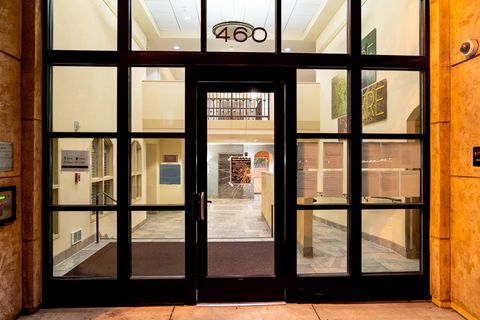 The glass on the front door of Avé Vista Apartment sits broken after several ground-level windows were smashed on the building during protests in Oakland, Calif., August 26, 2020. Residents said there were no residential units on the ground floor.