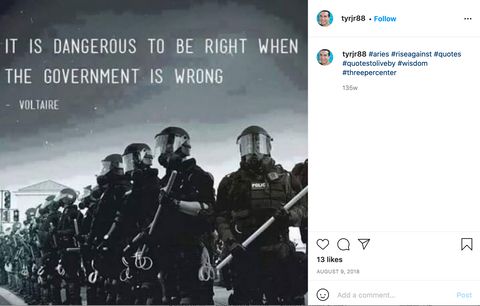 A photo of a line of riot cops with a quote attributed to Voltaire reading 'It is dangerous to be right when the government is wrong.'