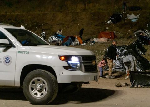 a border patrol truck pulls up to a makeshift tent
