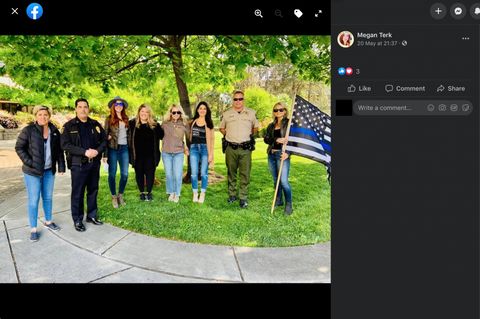 A facebook post from Megan Terk depicting six women, one holding a thin blue line flag, standing posed with two police officers