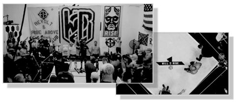 Left: A black & white photograph depicts a small crowd of people standing on three sides of a homemade arena. In the center, the “ref” holds up the arm of the winner, while a fan in the crowd puts up a Roman salute in a gesture of fascist respect. The back wall of the warehouse is covered in homemade banners that were made with stencils on canvas drop cloths. Left to right: [1] the SoCal Active club logo and the words: Revolt & Rise Above. At the bottom, “SoCal Active club” is partially covered by a group of spectators. [2] a very large W2R logo extends the length and width of the drop cloth, it towers above the crowd at the center of the scene. [3] The narrow banner at the top is the ripped-off Obey logo that Will2Rise uses, with the word “RISE” at the bottom. Below, there is another smaller banner with the SoCal Active club logo - a Celtic cross with two palm trees at 10 & 2. On the wall to the right, hangs a very large American flag and smaller Stars and Bars confederate flag below it. | Right: A black and white photograph taken directly above the square boxing ring. The “Rebirth of a New Frontier” logo is at the center of the floor with the words “WILL 2 RISE” emblazoned upon it. The SoCal Active club logo is painted beside it. 