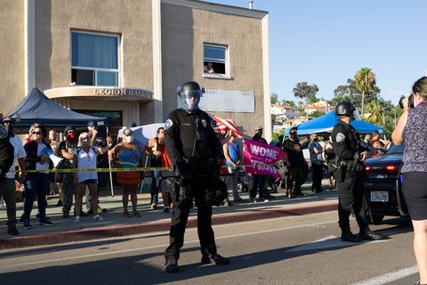 Police face protesters and not Defend East County members. Photo by Tom Mann.