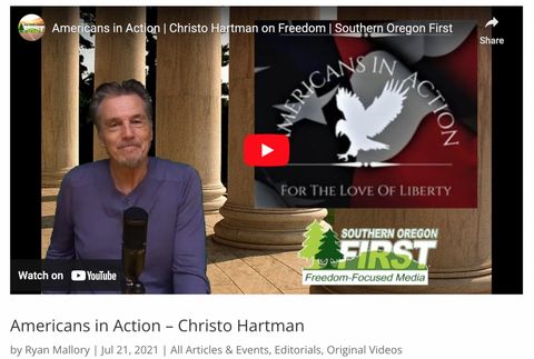 A man smiling at a microphone on a livestream with a panel at top right that reads "Americans in Action for the love of liberty" and a logo for "Southern Oregon First freedom-focused media" on the bottom right