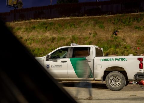 a border patrol truck drives by