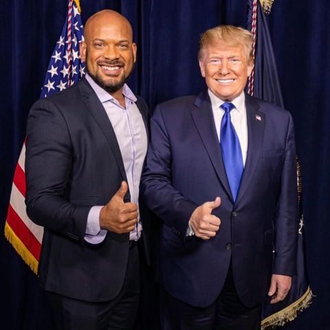 David Harris jr and Donald Trump posing for a photo giving the thumbs up.