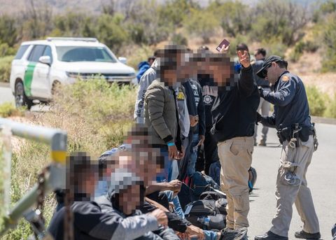 border patrol agents patting people down 