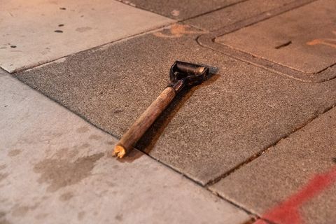 The top portion of a shovel lays broken on the ground outside an apartment building whose windows were smashed during the 'Justice for Jacob' protest in Oakland, Calif., August 26, 2020.