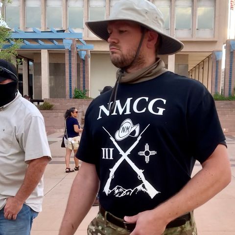Another member of the New Mexico Civil Guard wearing the racist militia's official t-shirt. Photo by Bella Davis.
