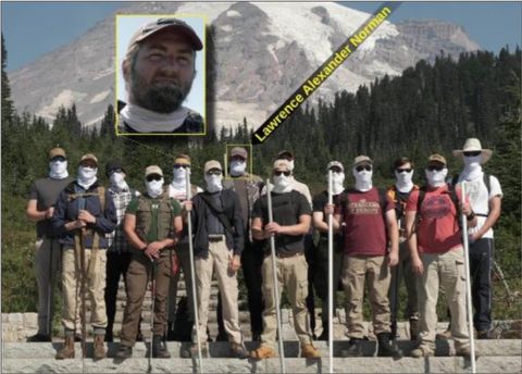 A group of Patriot Front members posing with masks on, with an inset photo highlighting Lawrence Alexander Norman with his face uncovered.