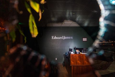 The interior of the Edward Jones office is seen through a broken window in Oakland, Calif., August 26, 2020. Protesters broke some windows and set small fires in the street as they were dispersed down Grand Avenue by Oakland police.