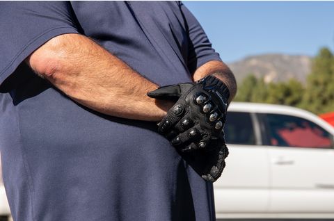 Far-right supporter wearing metal studded gloves.
